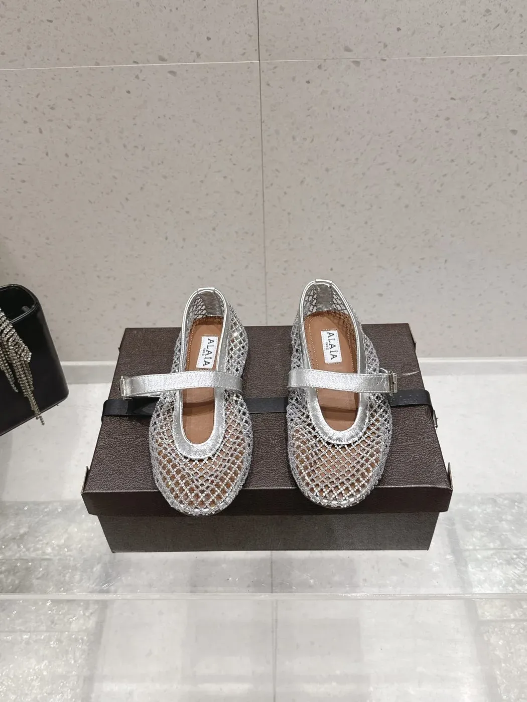 Alaïa Alternative Thong Ballet Sandal in Silver