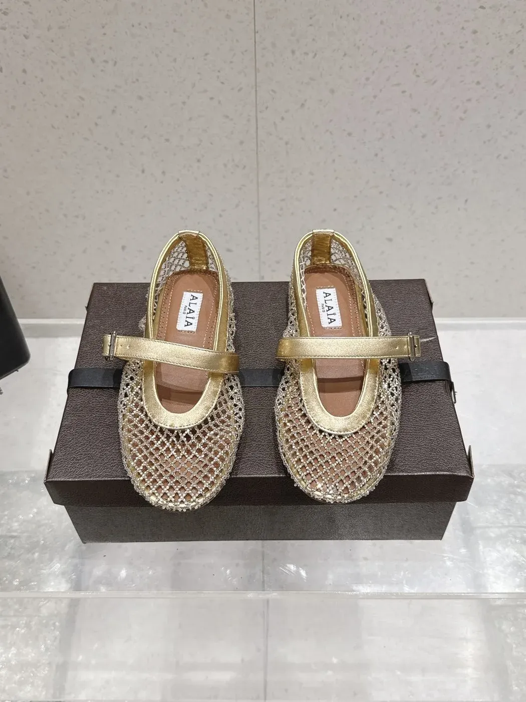 Alaïa Alternative Thong Ballet Sandal in Gold