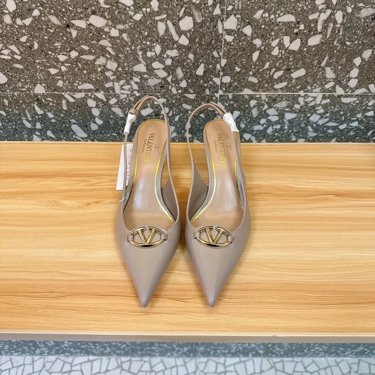 Valentino Alternative Logo Buckle Mules in 